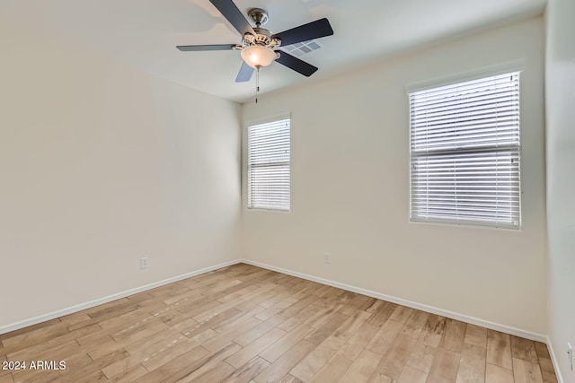 unfurnished room featuring light hardwood / wood-style floors and ceiling fan