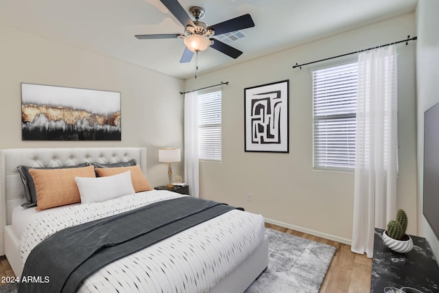 bedroom featuring ceiling fan and light wood-type flooring