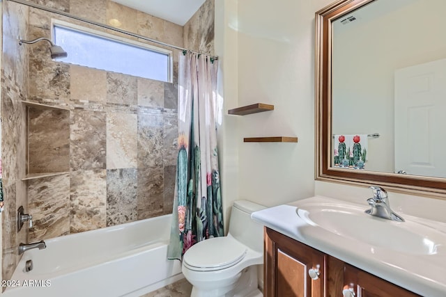 full bathroom featuring vanity, shower / bath combo, and toilet