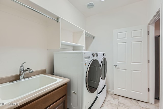 laundry room featuring sink and washer and clothes dryer