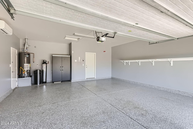 garage with a wall unit AC, a garage door opener, and gas water heater