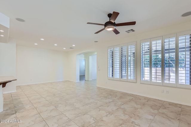 empty room featuring ceiling fan