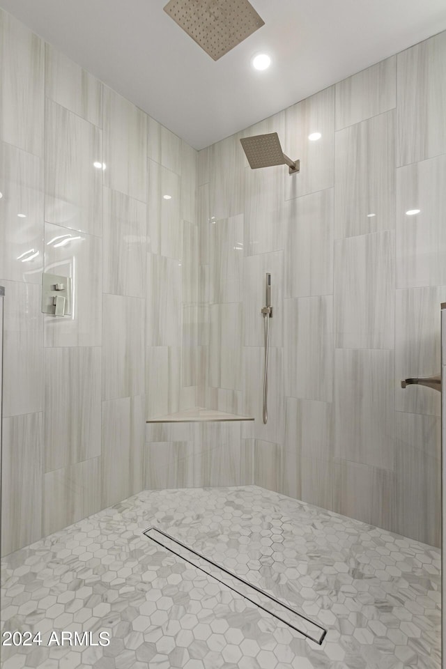 bathroom with a tile shower