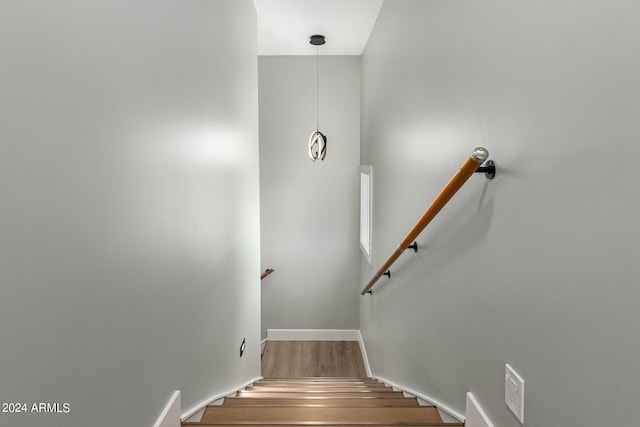 staircase featuring hardwood / wood-style floors