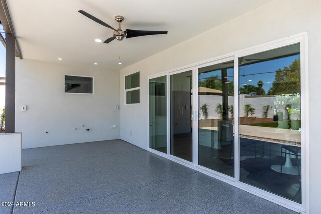 view of patio featuring ceiling fan