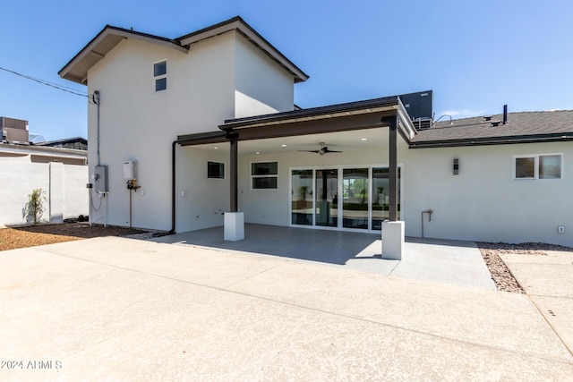 back of house with central AC, ceiling fan, and a patio