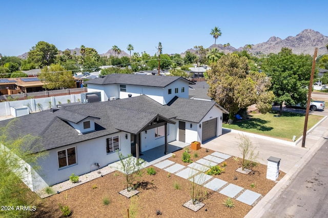 birds eye view of property featuring a mountain view