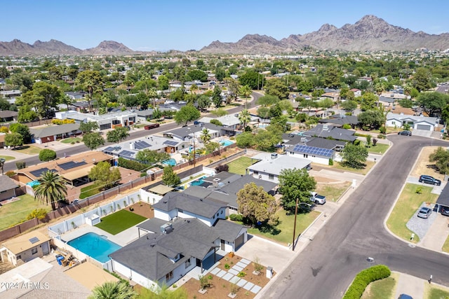 birds eye view of property with a mountain view