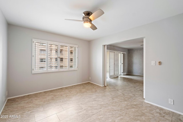 spare room with ceiling fan