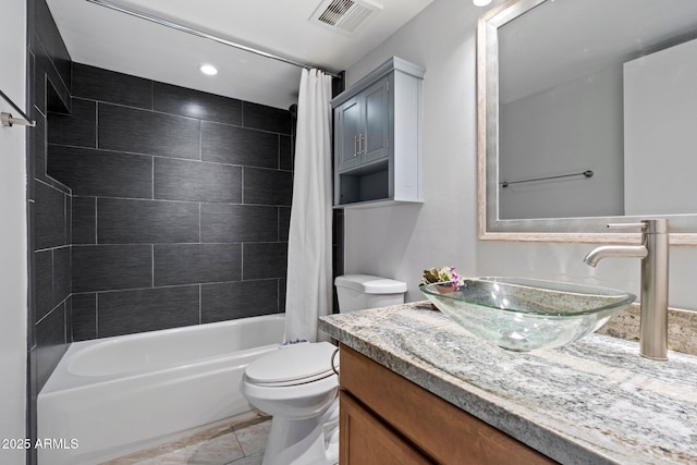 full bathroom with tile patterned flooring, vanity, shower / bathtub combination with curtain, and toilet