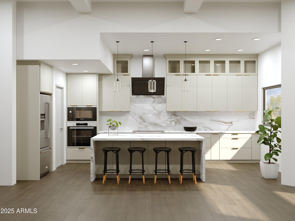 kitchen featuring a center island, a kitchen bar, decorative backsplash, appliances with stainless steel finishes, and wall chimney exhaust hood