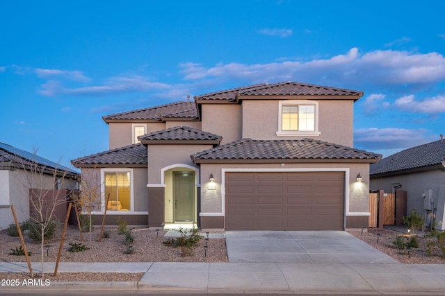 mediterranean / spanish house featuring a garage