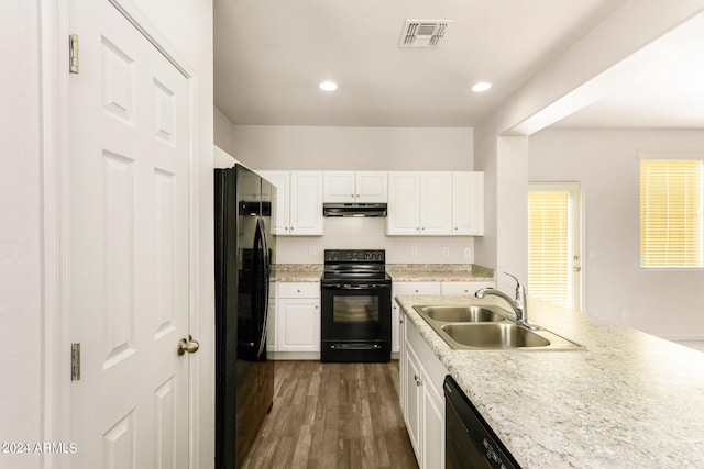 kitchen with white cabinetry, black appliances, sink, and dark hardwood / wood-style flooring