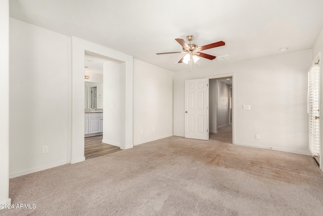 carpeted empty room with ceiling fan