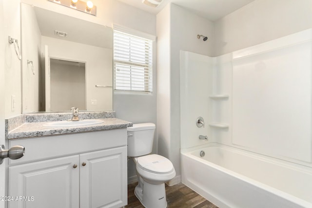 full bathroom with vanity, toilet, bathtub / shower combination, and hardwood / wood-style flooring