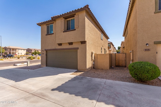 view of side of property with a garage