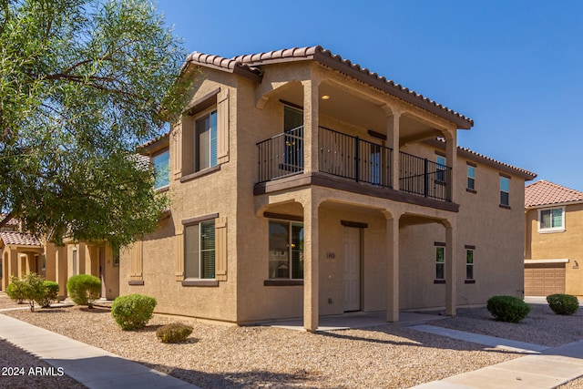 exterior space featuring a balcony