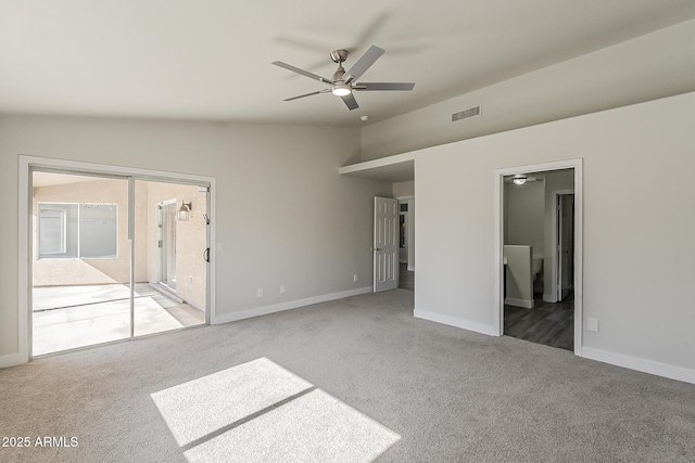 15360 N 87th Ave, Peoria, AZ 85381 - unfurnished bedroom featuring light carpet, vaulted ceiling, baseboards, and ensuite bathroom