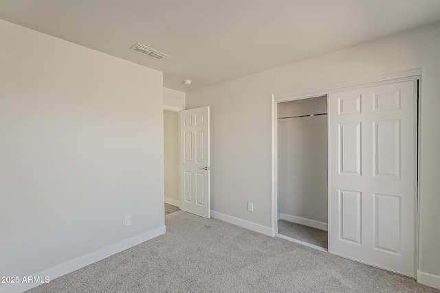 15360 N 87th Ave, Peoria, AZ 85381 - unfurnished bedroom featuring carpet, baseboards, and a closet