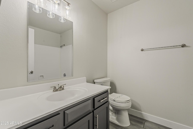 15360 N 87th Ave, Peoria, AZ 85381 - bathroom with toilet, vanity, and baseboards