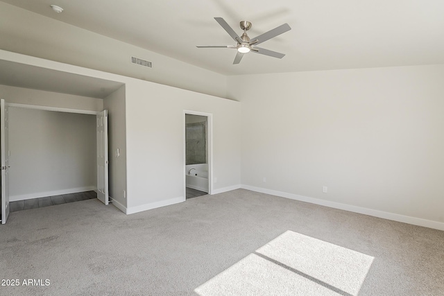 15360 N 87th Ave, Peoria, AZ 85381 - unfurnished bedroom featuring carpet flooring, baseboards, a ceiling fan, and connected bathroom