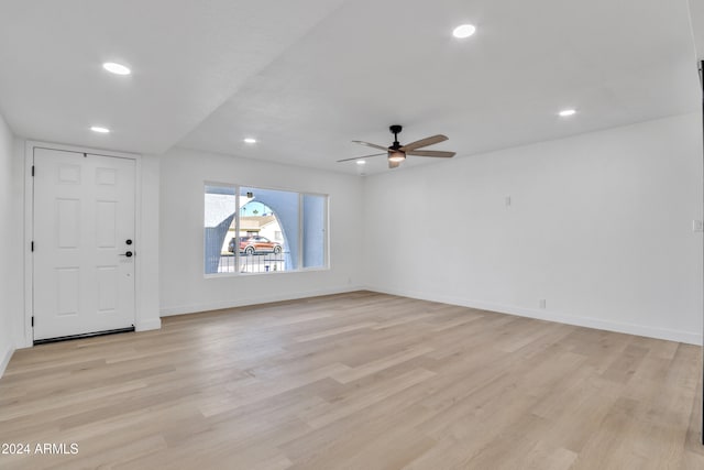 unfurnished living room with ceiling fan and light wood-type flooring