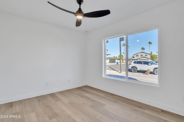 spare room featuring ceiling fan and light hardwood / wood-style floors