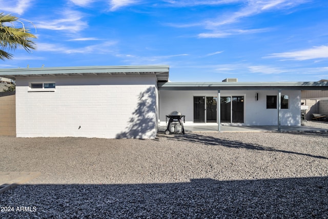 back of property featuring a patio area