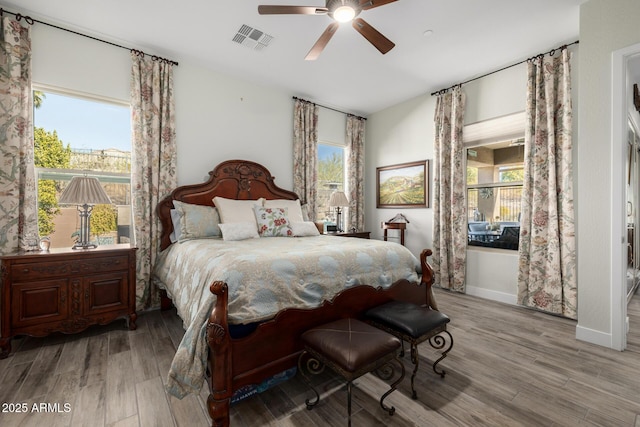 bedroom featuring light wood-type flooring and ceiling fan