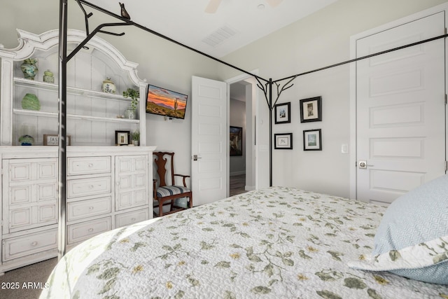 bedroom with ceiling fan and carpet flooring