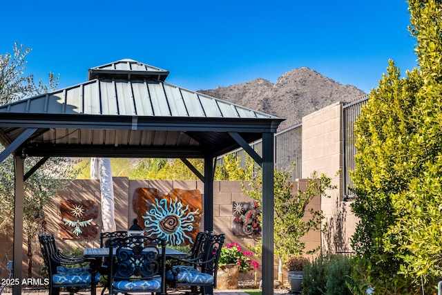 exterior space featuring a gazebo and a mountain view