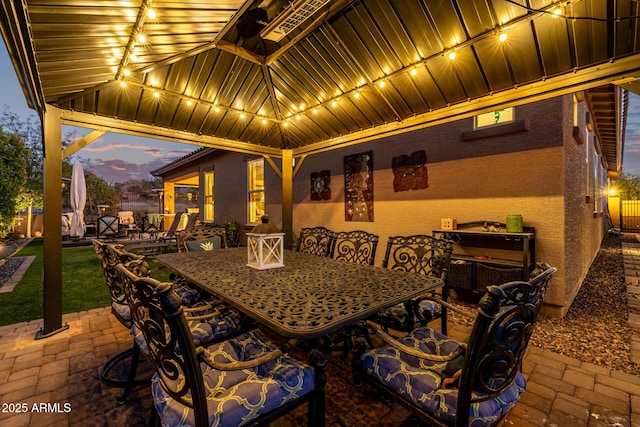 patio terrace at dusk featuring a gazebo