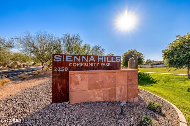 community sign featuring a lawn