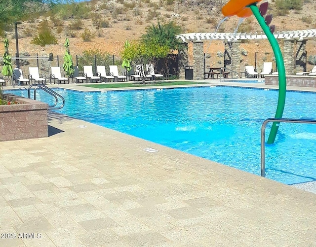 view of pool featuring a patio and a pergola