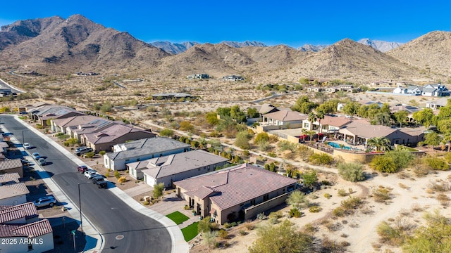 birds eye view of property featuring a mountain view