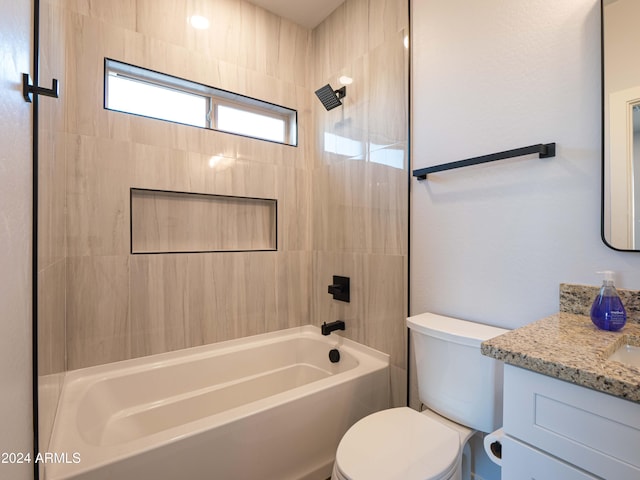 full bathroom with vanity, toilet, and tiled shower / bath combo