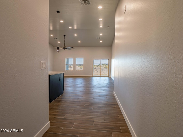 hallway featuring dark wood-type flooring