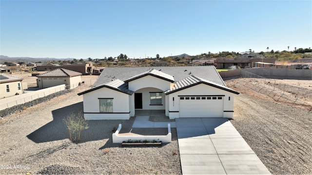 ranch-style home featuring a garage