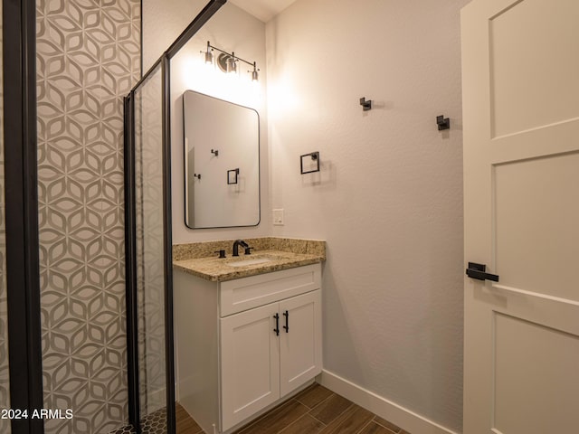 bathroom with vanity and wood-type flooring