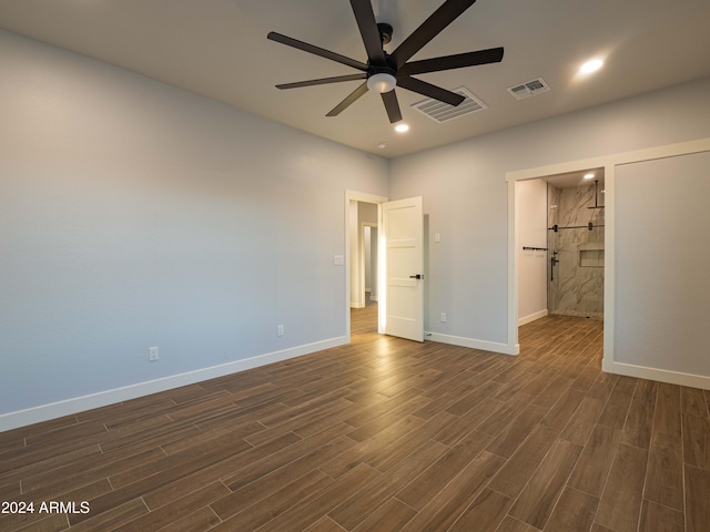 unfurnished bedroom featuring ceiling fan and dark wood-type flooring