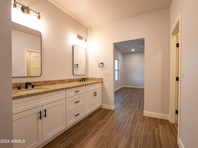 bathroom featuring vanity, hardwood / wood-style flooring, and ceiling fan