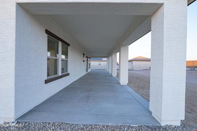 view of patio terrace at dusk