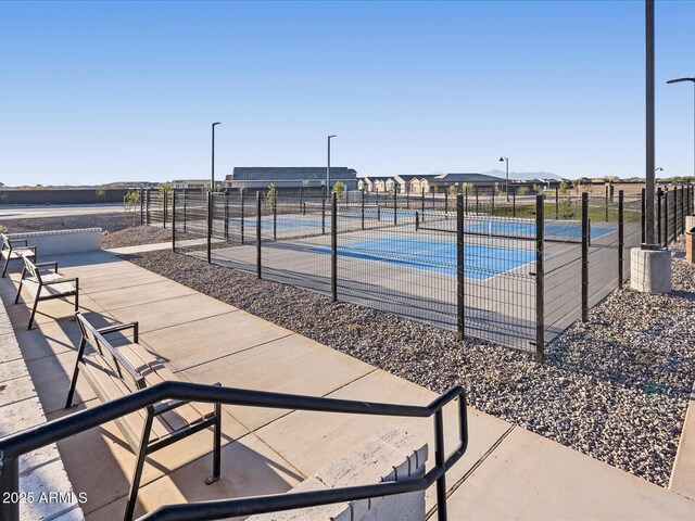 exterior space with a patio area, fence, and a pool