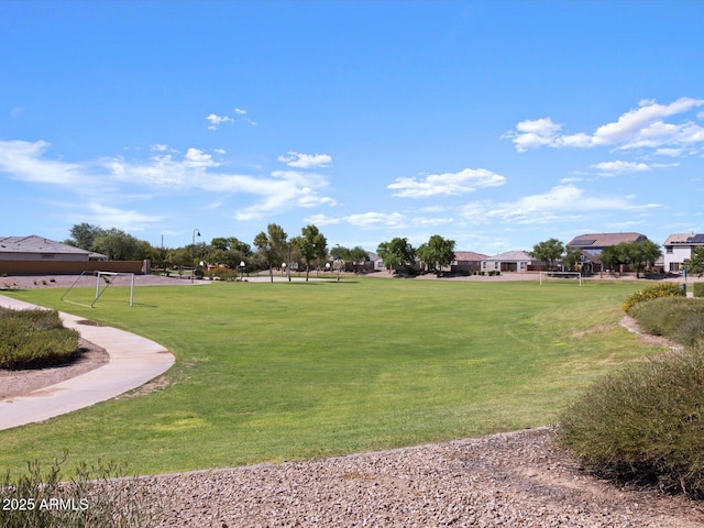 view of home's community featuring a lawn