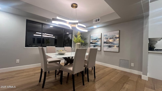 dining area with wood-type flooring