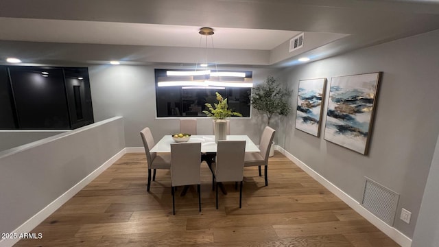 dining space featuring hardwood / wood-style floors