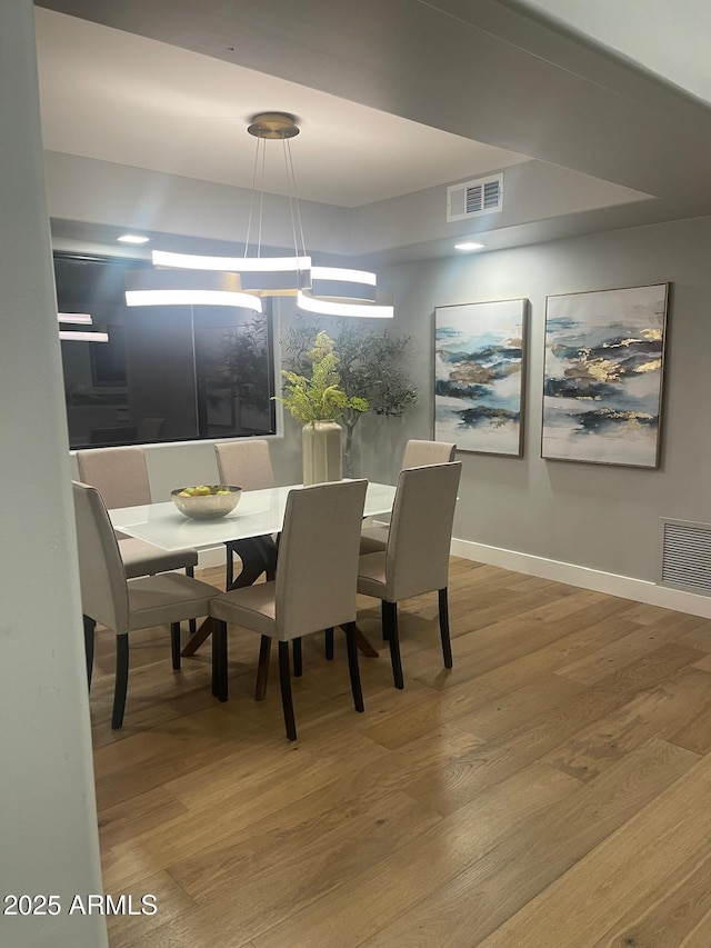 dining area featuring wood-type flooring