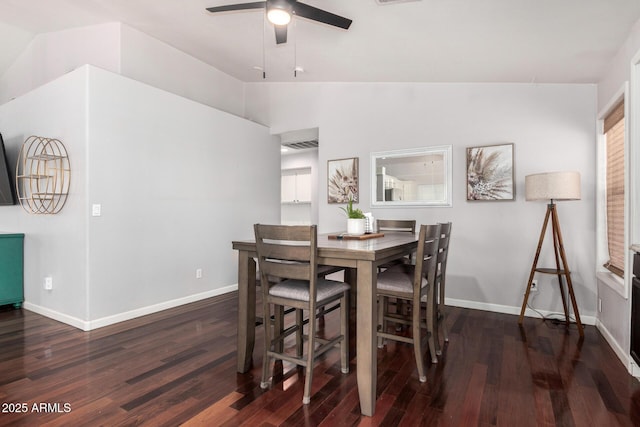 dining area featuring baseboards, ceiling fan, wood finished floors, and lofted ceiling