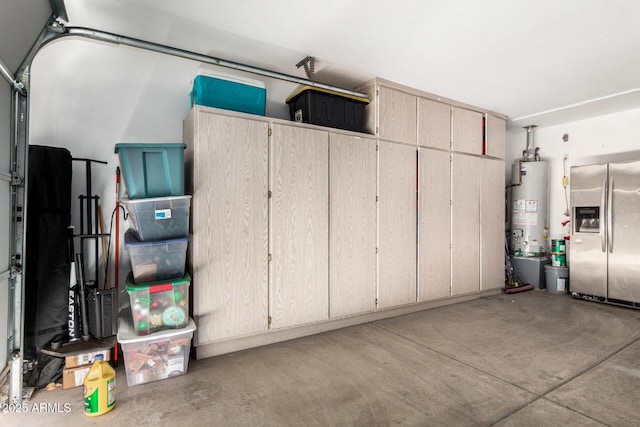 garage featuring stainless steel fridge and water heater
