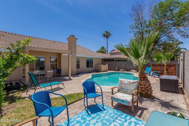 view of swimming pool with a patio, a fenced backyard, and a fenced in pool
